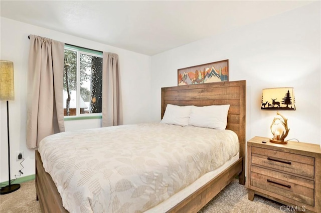 bedroom featuring light carpet