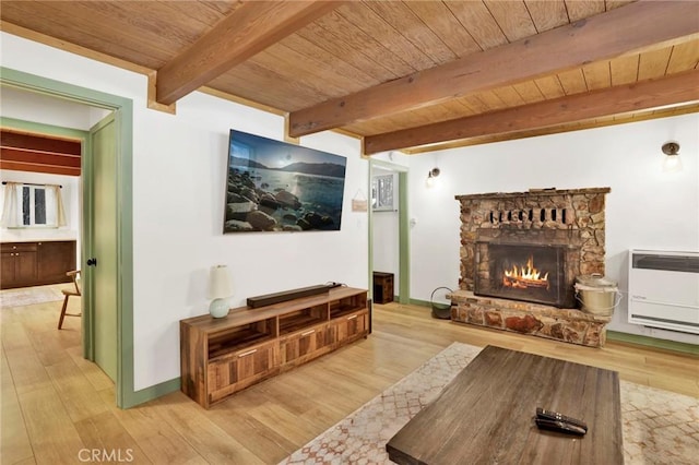 living room featuring wood ceiling, light hardwood / wood-style floors, and heating unit