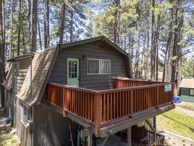 back of house featuring a deck