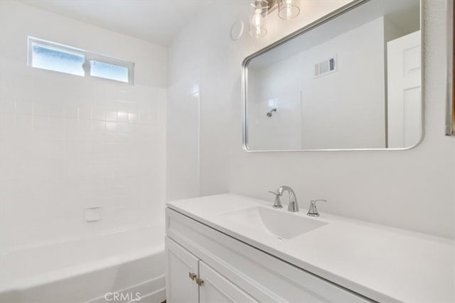 bathroom featuring vanity and washtub / shower combination