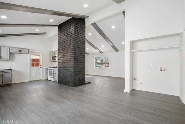 unfurnished living room featuring dark hardwood / wood-style flooring, a wealth of natural light, and decorative columns