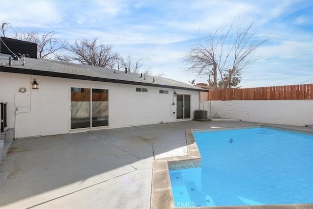 view of swimming pool with central AC unit and a patio area