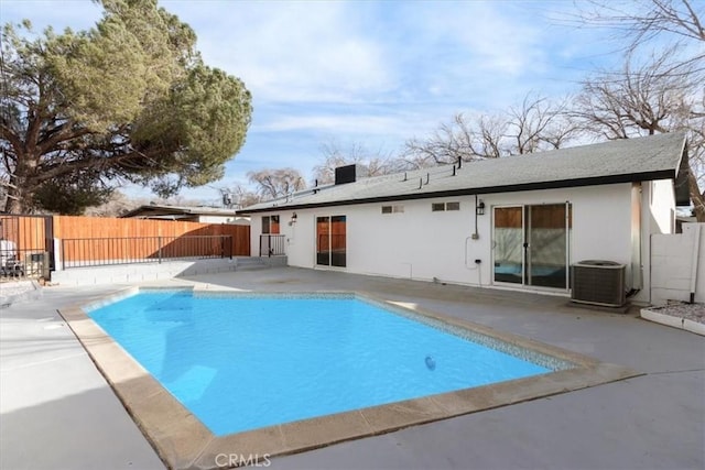 view of pool with central AC and a patio area