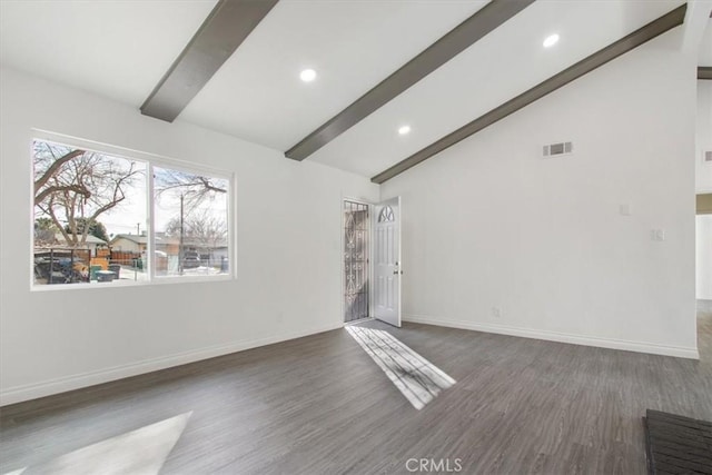 spare room with beamed ceiling, dark hardwood / wood-style floors, and high vaulted ceiling