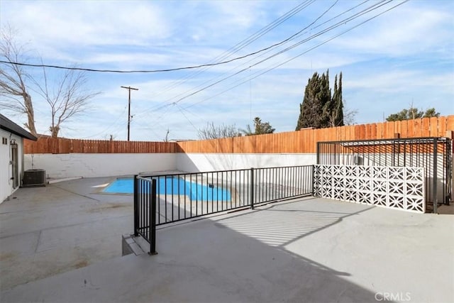 view of patio / terrace featuring a fenced in pool