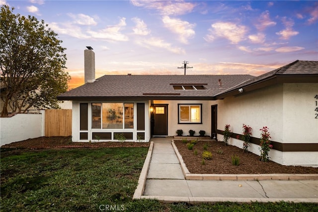 view of front of home featuring a yard