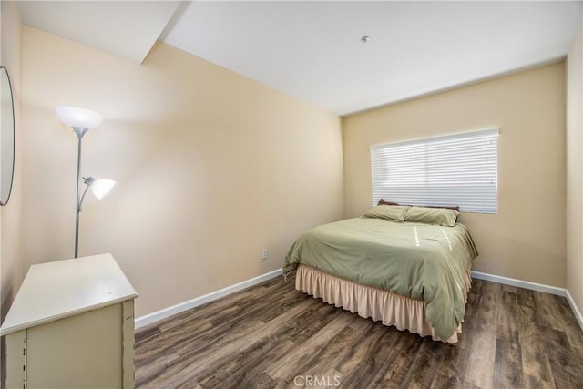 bedroom featuring dark wood-type flooring