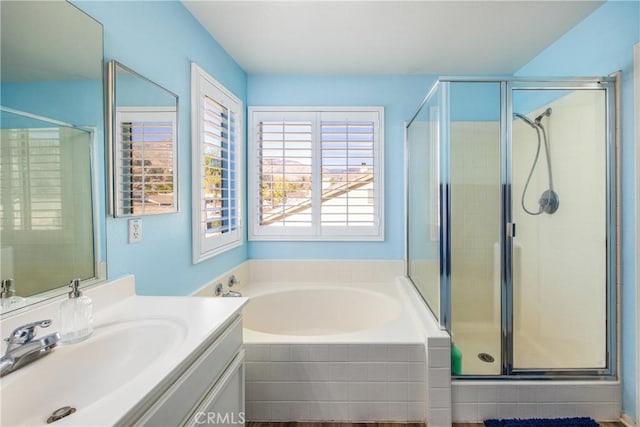 bathroom featuring vanity and separate shower and tub