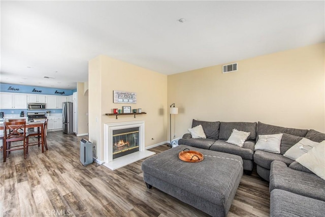 living room featuring dark hardwood / wood-style floors