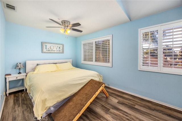 bedroom with dark wood-type flooring and ceiling fan