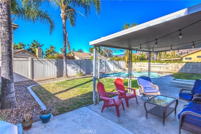 view of patio featuring a fenced in pool