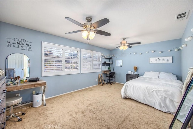 bedroom with ceiling fan and carpet