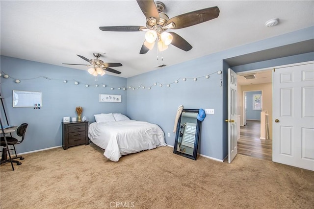 carpeted bedroom with ceiling fan