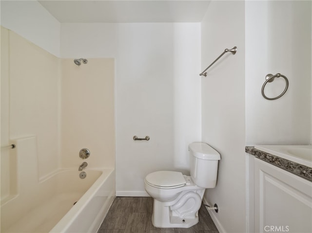 full bathroom featuring vanity, hardwood / wood-style floors, shower / tub combination, and toilet