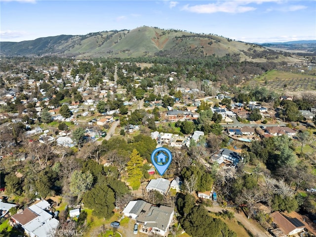 drone / aerial view featuring a mountain view