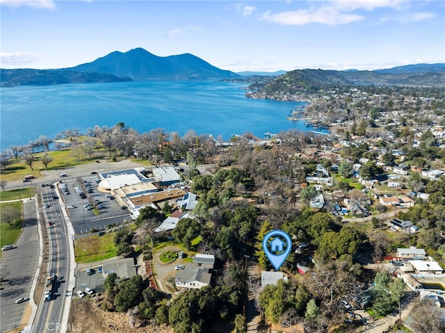 birds eye view of property featuring a water and mountain view