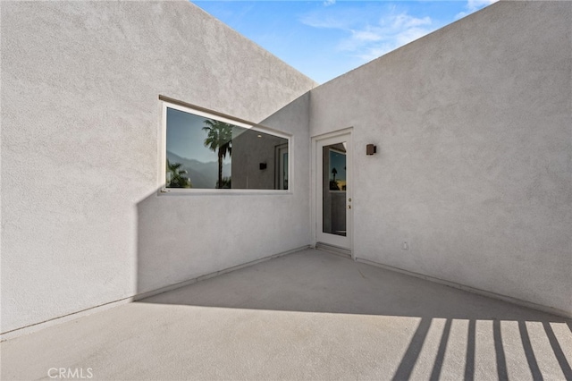 doorway to property featuring a patio area