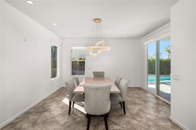 dining space featuring an inviting chandelier