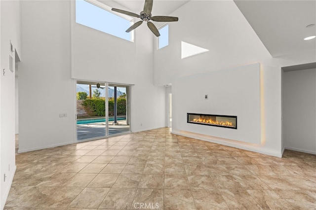 unfurnished living room featuring ceiling fan