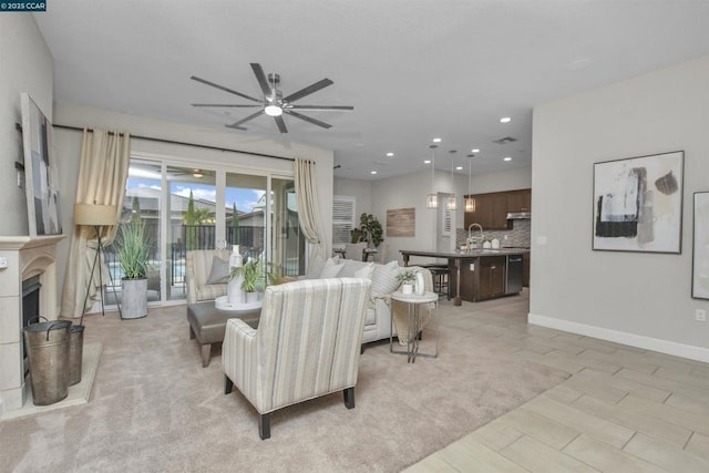 living room with sink and ceiling fan