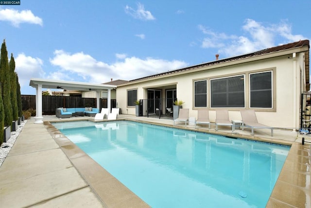 view of swimming pool featuring an outdoor living space and a patio area