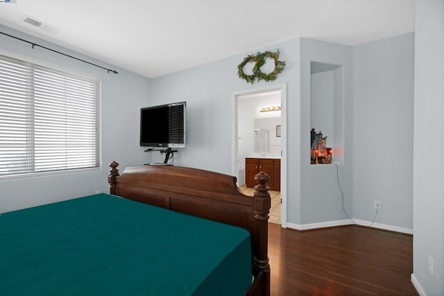 bedroom featuring dark hardwood / wood-style flooring