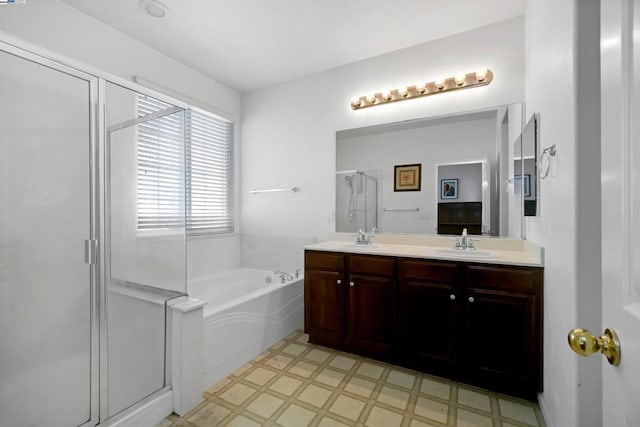 bathroom with plus walk in shower and vanity