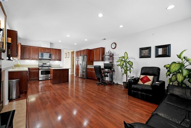 living room with sink and hardwood / wood-style flooring