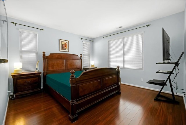 bedroom featuring dark hardwood / wood-style flooring