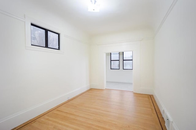 unfurnished room with light hardwood / wood-style floors