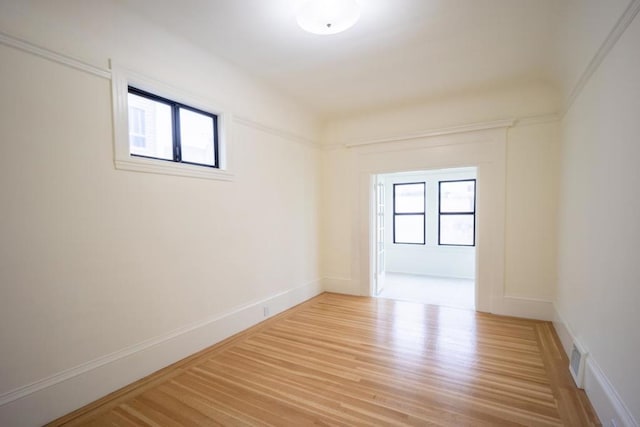 spare room with light hardwood / wood-style flooring