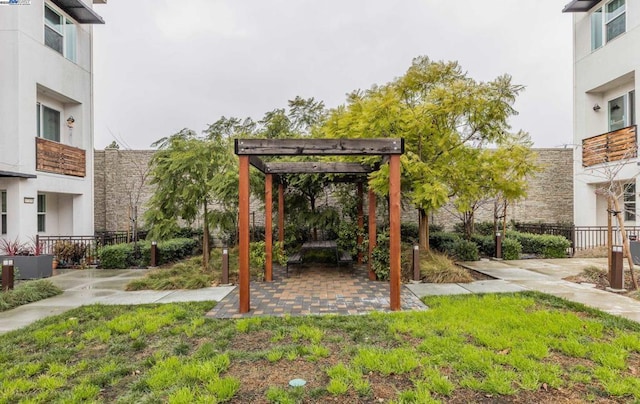 view of yard with a pergola and a patio area