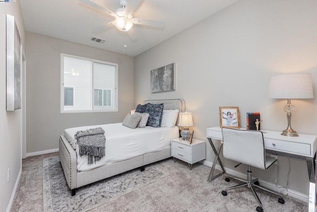 bedroom featuring light colored carpet and ceiling fan