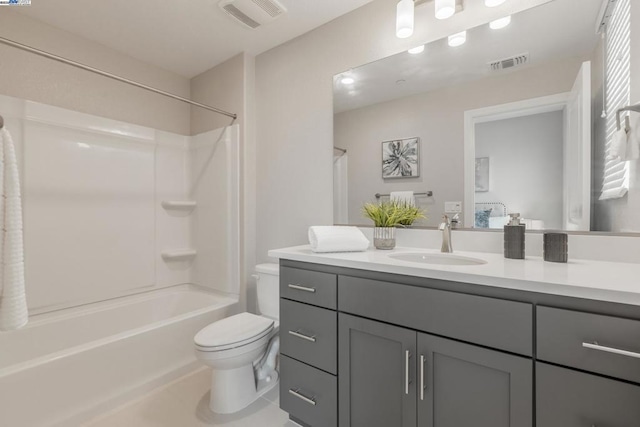 full bathroom with vanity, toilet, and  shower combination