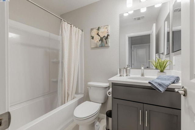 full bathroom featuring vanity, toilet, and shower / tub combo