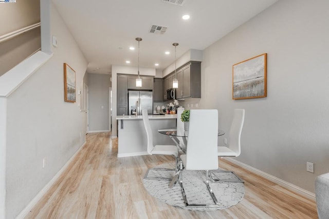 dining space featuring light hardwood / wood-style floors