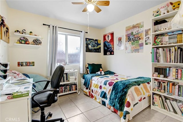 bedroom with light tile patterned flooring and ceiling fan