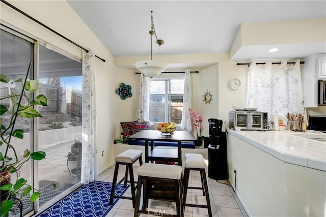 dining space with light tile patterned floors