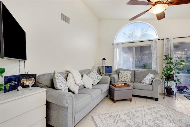 living room with light tile patterned floors and ceiling fan