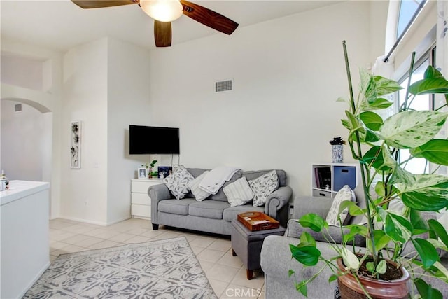 living room with ceiling fan and light tile patterned floors