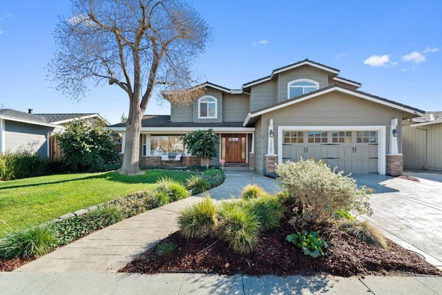 view of front of home with a garage and a front yard