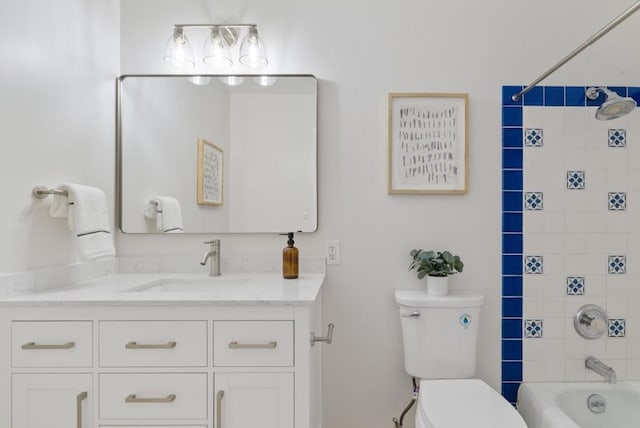 full bathroom with vanity, toilet, and tiled shower / bath