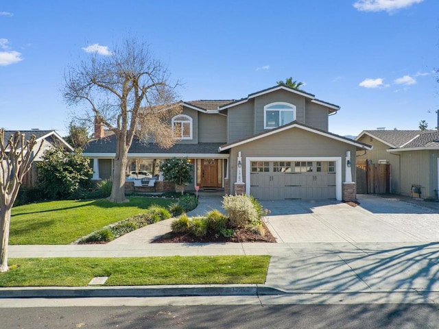 front of property with a garage and a front lawn