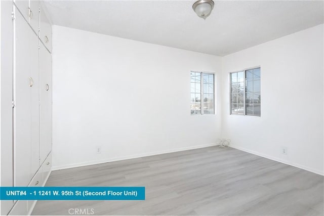 unfurnished room featuring light hardwood / wood-style floors