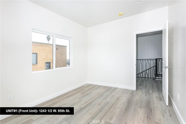 spare room with light hardwood / wood-style floors