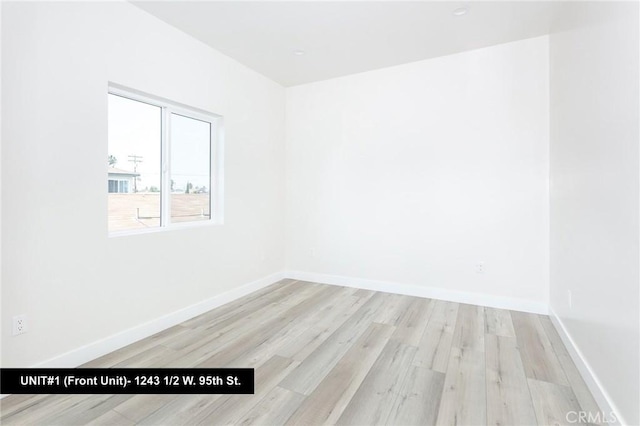 unfurnished room featuring light wood-type flooring