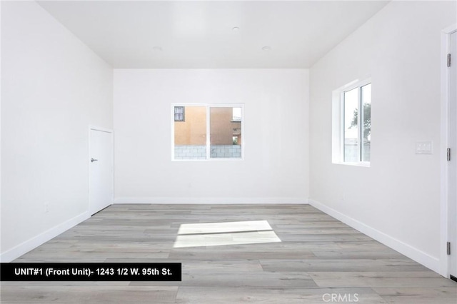 unfurnished room featuring light hardwood / wood-style flooring