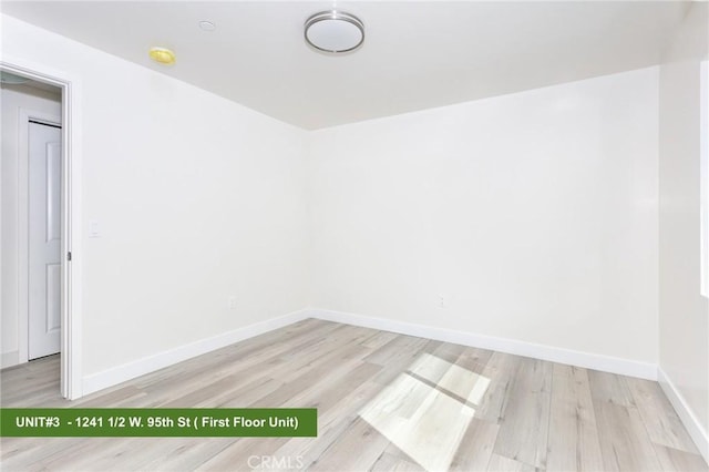 spare room featuring light hardwood / wood-style flooring