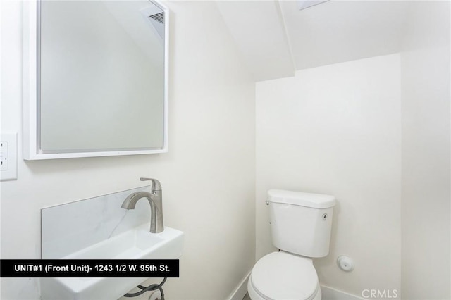 bathroom with sink and toilet