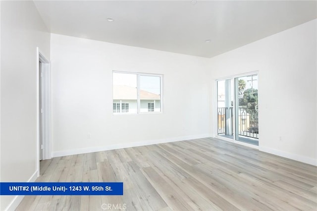 empty room with light hardwood / wood-style floors